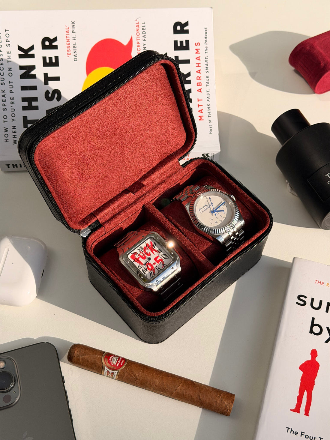 Custom modified Seiko watches with aftermarket parts in red travel case